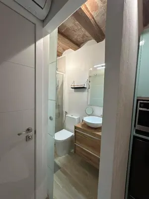 a bathroom with a toilet and a sink at Stay Happy in Barcelona