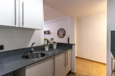 a kitchen with a sink and a counter top at Acogedor apartamento Diagonal Mar in Barcelona