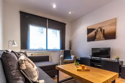 a living room with a couch and a table at Nuevo apartamento zona Paseo de Gracia in Barcelona