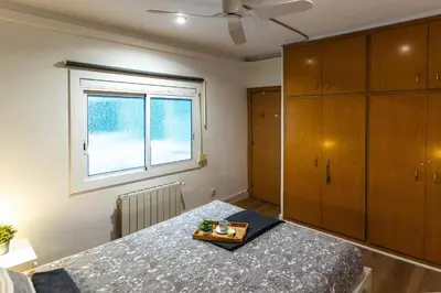 a bedroom with a bed and a window at Nuevo apartamento zona Paseo de Gracia in Barcelona