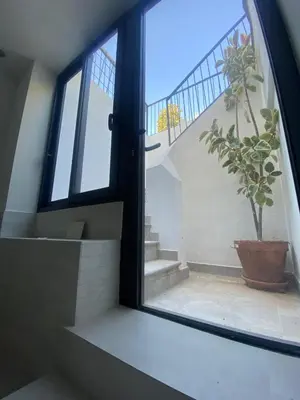 a living room with a stone fireplace in a room at Apartment in Premia de Dalt