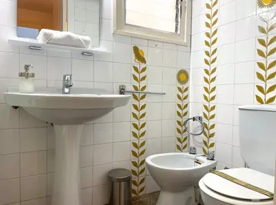 a bathroom with a sink and a toilet at Apartment Vicente in Vilanova i la Geltrú