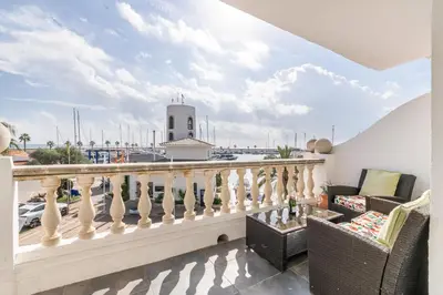 a balcony with a view of a marina at Esencia Mediterránea Precioso en primera linea in Sitges