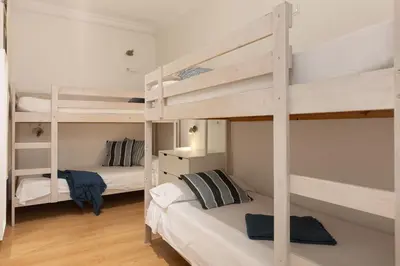 a bedroom with two bunk beds in a room at Lets Holidays Centric Apartment in Barcelona in Barcelona