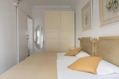 a bedroom with a bed with two pillows on it at Lets Holidays Centric Apartment in Barcelona in Barcelona