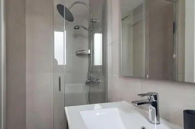 a bathroom with a sink and a shower at Casa Atrio - Wonderful studio near Barcelona cathedral in Barcelona