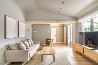 a living room with a couch and a tv at Villa Atardecer in Barcelona