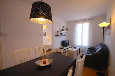 a kitchen and living room with a table and a dining room at Lets Holidays Apartment Barcelona near beach in Barcelona