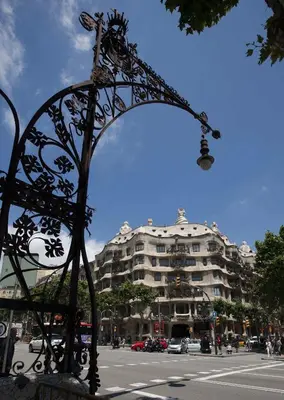 a metal arch in front of a large building at Lets Holidays Apartment Sea Views in Barcelona in Barcelona