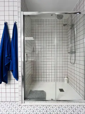 a shower with a glass door in a bathroom at Espectacular Sunny House in the beach in Cunit
