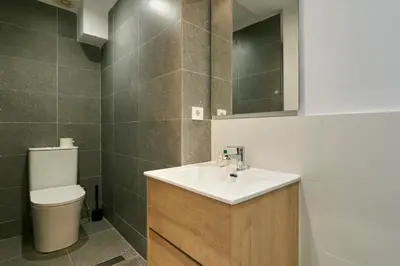 a bathroom with a sink and a toilet at Vibrant and modern apartment in Barcelona