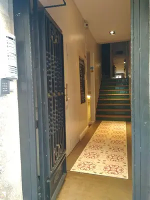 an open door to a hallway with a staircase at AinB Las Ramblas-Guardia Apartments in Barcelona