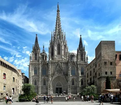 a large cathedral with people walking in front of it at Room not shared center liceu ramblas plaza Cataluña in Barcelona