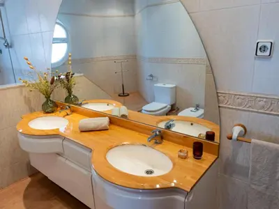a bathroom with two sinks and a mirror at Casa Serenidad: Naturaleza, Jacuzzi & Parking en Cubelles - ES-332-10 in Cubelles