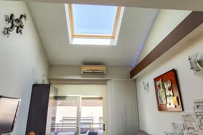a skylight in the ceiling of a room at Fee4Me Comfortable flat near the sea in Sant Adria de Besos