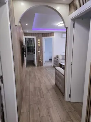 a hallway with an archway and a living room at Apartamento Moderno, amplio y muy cómodo in Terrassa