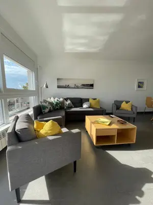 a living room with a couch and a coffee table at Viva Sitges - Sitges View in Sitges