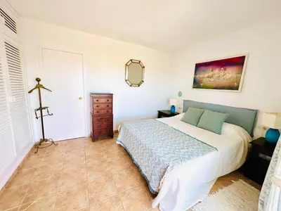 a bedroom with a bed and a dresser in it at Solaui in Esplugues de Llobregat