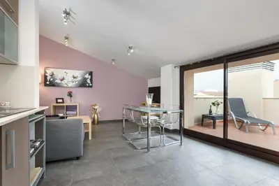 a living room with a table and a dining room at Matarolux 1 in Mataró