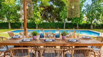 a swimming pool with frisbees in a yard at Villa Abu Lita 3 minutos andando playa Renovada Piscina y Jardin XXL Autentico lujo in Sitges