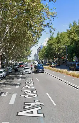 a street with a sign that says slow on the road at Casa a pasos de Las Ramblas in Barcelona