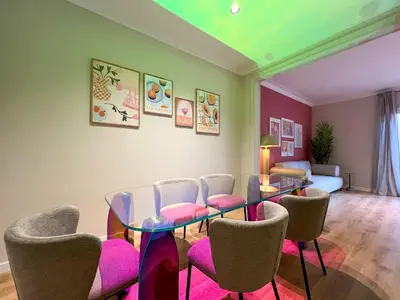 a dining room with a glass table and chairs at Stay U-nique Apartment Castanyer in Barcelona