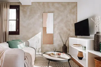 a living room with a couch and a table at Casa Ciudadela in Barcelona