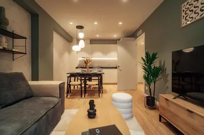 a living room with a couch and a table at Casa Castaner in Barcelona