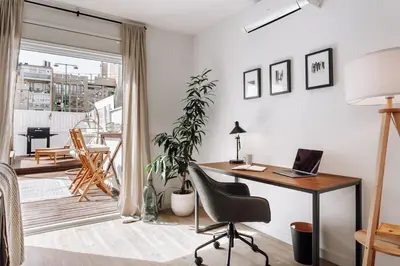 a home office with a desk and a chair at Casa Narciso in Barcelona