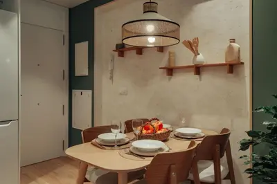 a dining room table with a bowl of fruit on it at Casa Duran in Barcelona