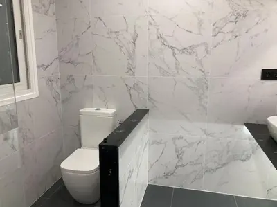 a white bathroom with a toilet and a sink at House Seaviews Barcelona 22Km in Cabrils