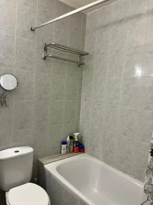 a bathroom with a toilet and a tub and a sink at Triumf in Barcelona