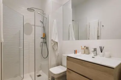 a bathroom with a shower and a toilet and a sink at Casa Jordi in Barcelona
