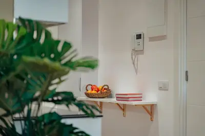 a bowl of fruit on a shelf in a room at Casa Laietana in Barcelona