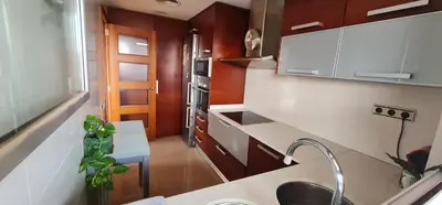 a kitchen with a sink and a counter top at Pis molt cèntric amb vistes in Terrassa