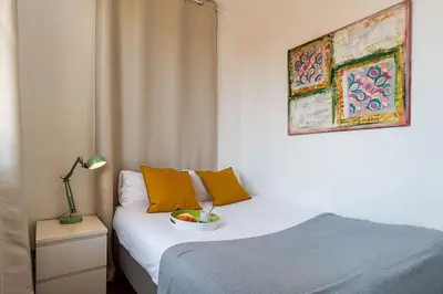 a bedroom with a bed with a bowl of fruit on it at Canela Homes BARCELONA ATIC in Barcelona