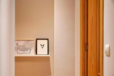 a shelf in a room with a picture on it at Canela Homes BARCELONA TETUAN in Barcelona