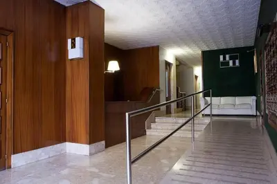 a hallway with stairs in a building at Canela Homes BARCELONA TETUAN in Barcelona
