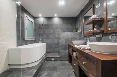 a bathroom with two sinks and a bath tub at Canela Homes BARCELONA CENTRAL in Barcelona
