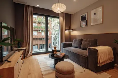 a living room with a couch and a table at Casa Tila in Barcelona