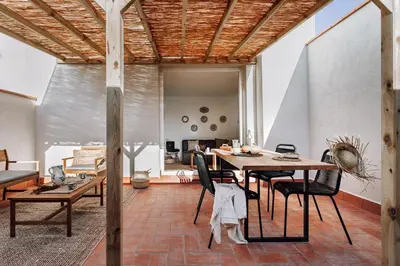 a bedroom with a large bed with two side tables at Olivo - 1 bedroom and terrace in Eixample Esquerra in Barcelona