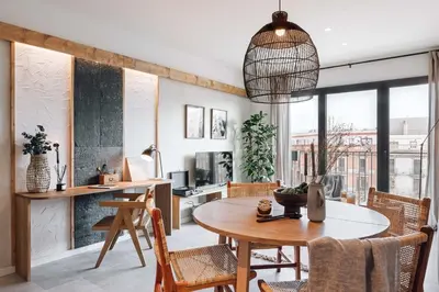 a kitchen and dining room with a table and chairs at Ferrat - 3 bedrooms in Eixample Esquerra in Barcelona