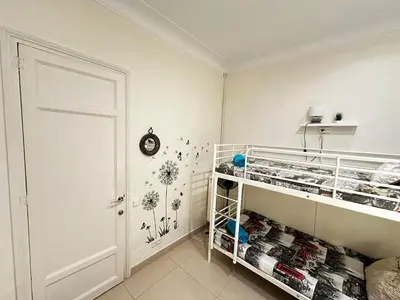 a bedroom with a bed and a flat screen tv at Isabela rooms in Barcelona