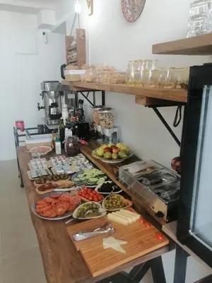 a buffet with many plates of food on a table at Vilador Barcelona Beach Hotel in Masnou