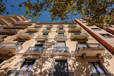 a tall building with balconies on the side of it at Sweett - Urgell Eixample in Barcelona