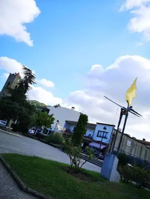 a statue of a bird on a windmill on a street at Vista Alegre Casa Rest House in Vallromanas