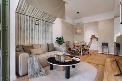 a living room with a couch and a table at Niebla - 1 bedroom in Eixample Esquerra in Barcelona