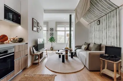 a bedroom with a large bed and a desk at Niebla - 1 bedroom in Eixample Esquerra in Barcelona