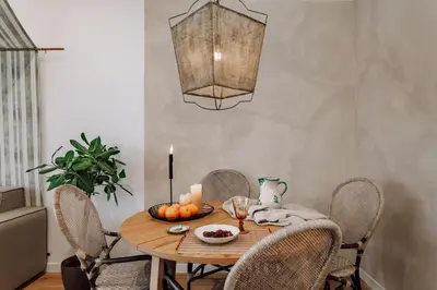 a living room with a couch and a tv at Niebla - 1 bedroom in Eixample Esquerra in Barcelona