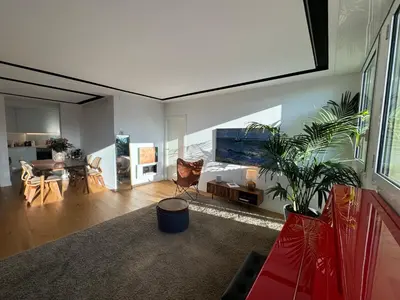 a living room with a large aquarium in the wall at Paseo de Gracia Residences in Barcelona